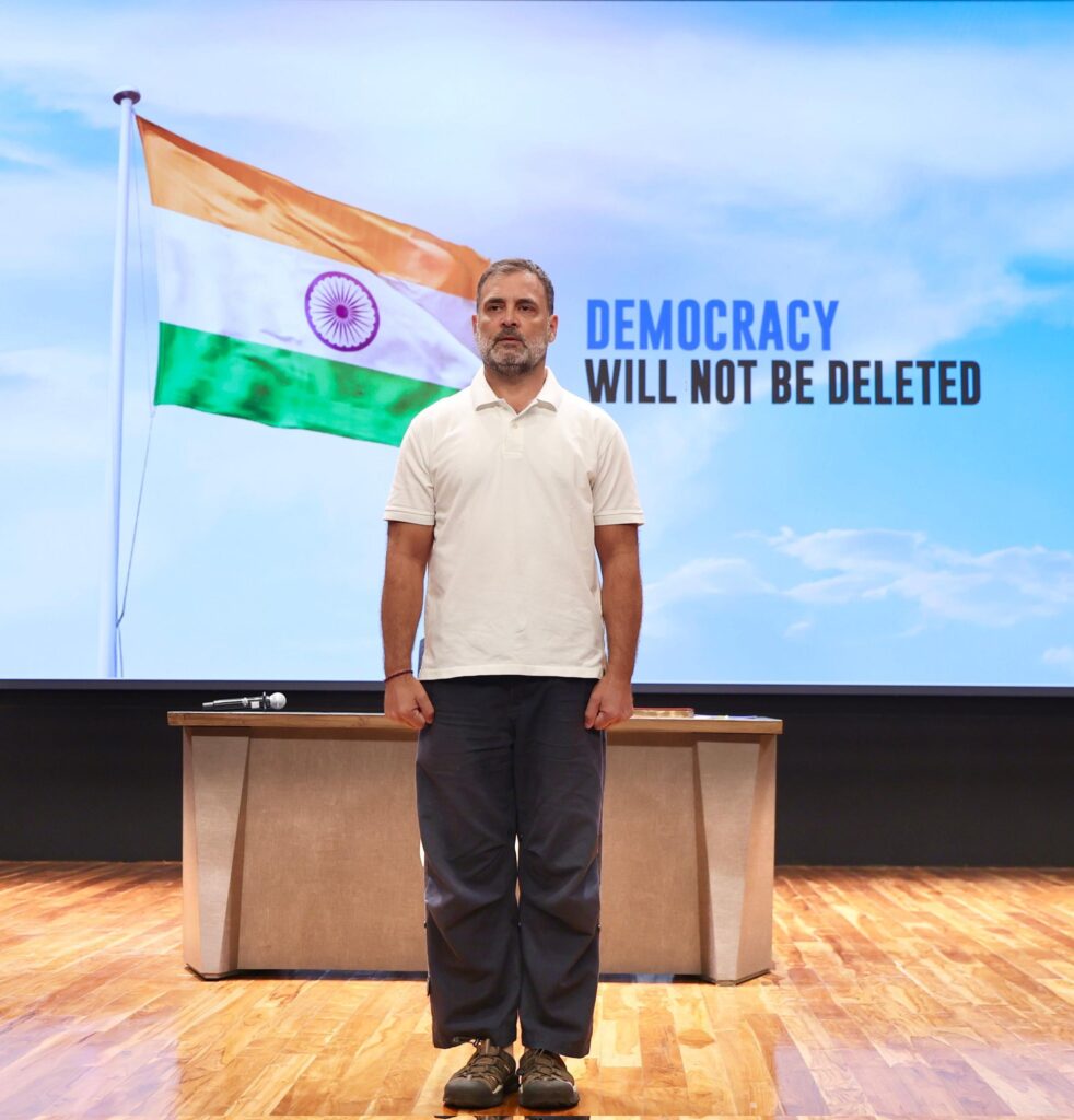 Rahul Gandhi Drops Explosive ‘Vote Chori’ Proofs: 6,000+ Deletions, CID Letters, and the Awaited “Hydrogen Bomb” 1 Rahul Gandhi at press conference on vote chori allegations with Indian flag backdrop reading Democracy Will Not Be Deleted