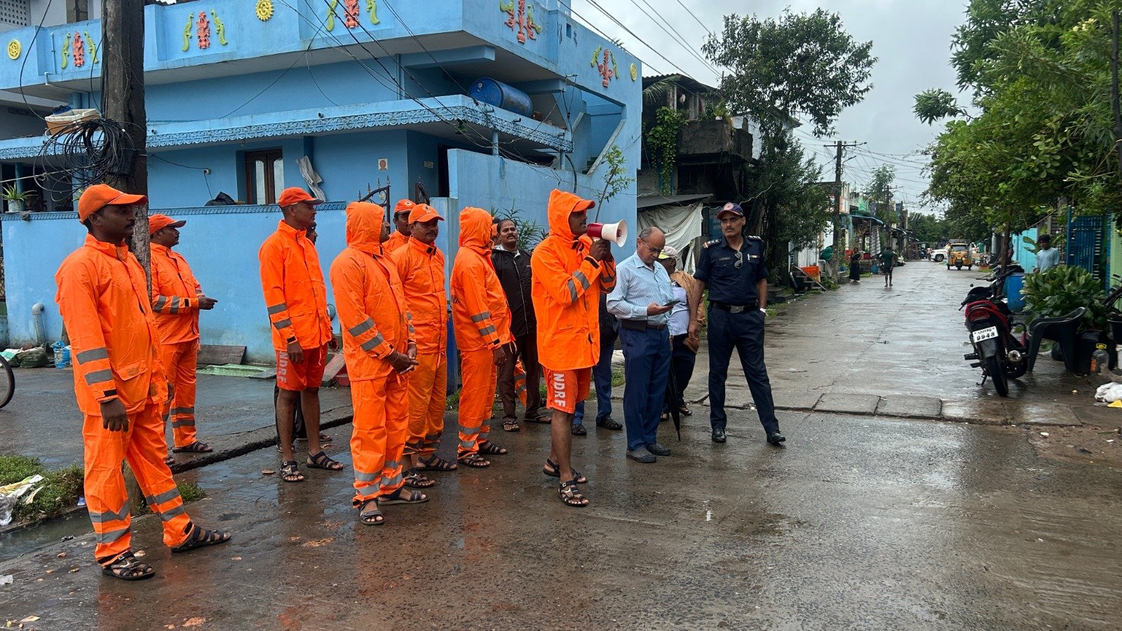 Cyclone Montha Alert: Powerful Storm Set to Hit Andhra with 110 km/h Winds 1 NDRF personnel alerting villagers in Andhra Pradesh before Cyclone Montha landfall