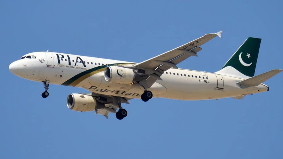 Pakistan’s High-Stakes PIA Sale Heads Into a Make-or-Break and Powerful Auction on December 23 1 Pakistan flags and PIA aircraft at airport.