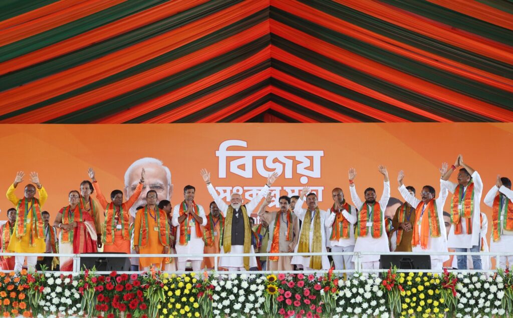 Modi’s 6 Guarantees Ignite Bengal Election Battle, Promise Law, Jobs and Reform 1 Modi addressing Bengal rally announcing six guarantees